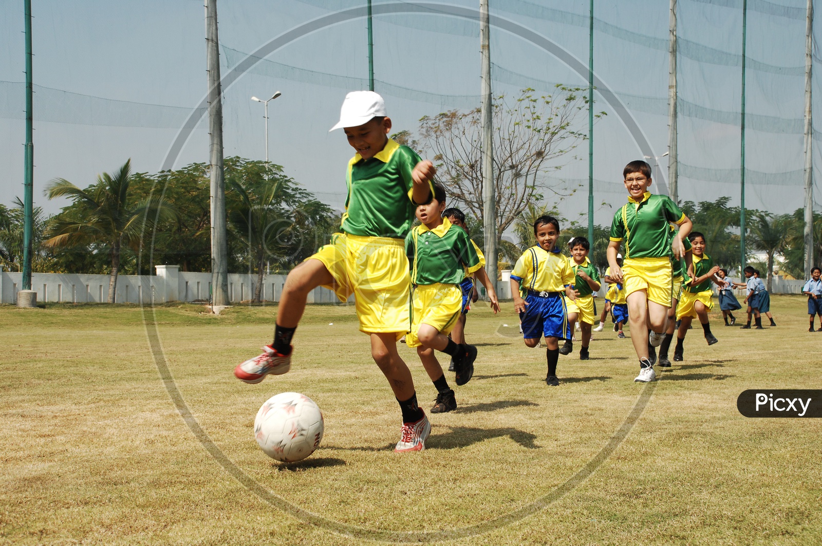 School Children Playing Football