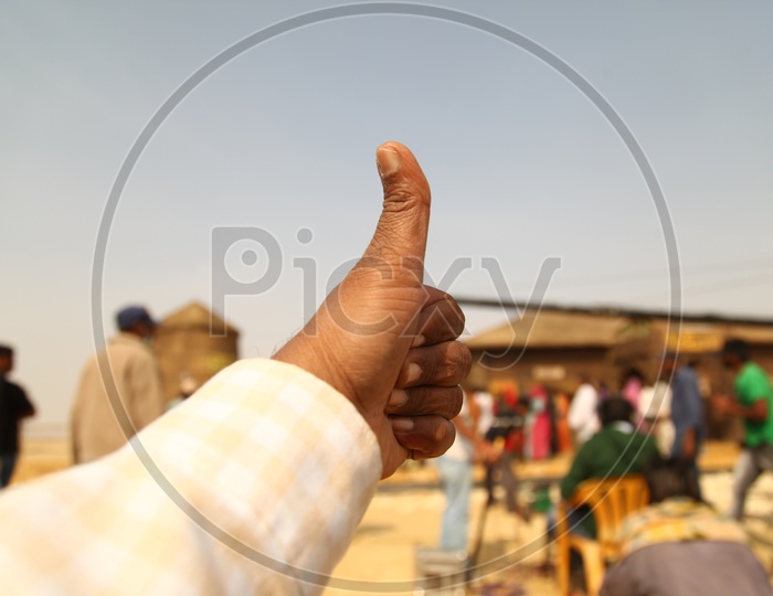An Indian Man With Thumps Up Symbol Closeup Shot Of Hand