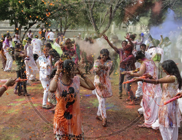 People celebrating holi festival / People throwing colors to each other during the Holi celebration in Hyderabad/ Indian Festival