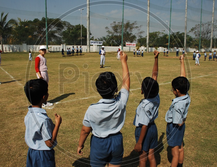 Children cheering other kids at the School Sport day