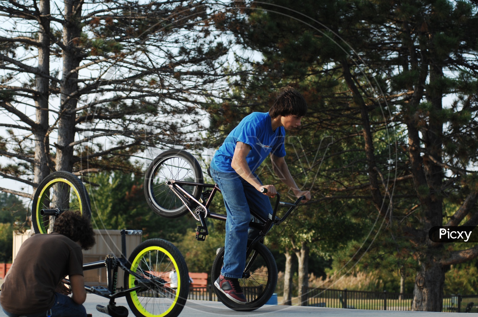 Children Riding Bicycle and doing Stunts
