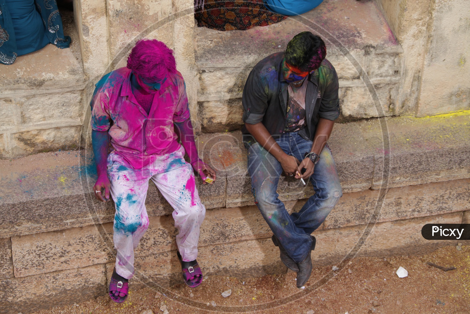 Two People Smoking After Holi Celebrations