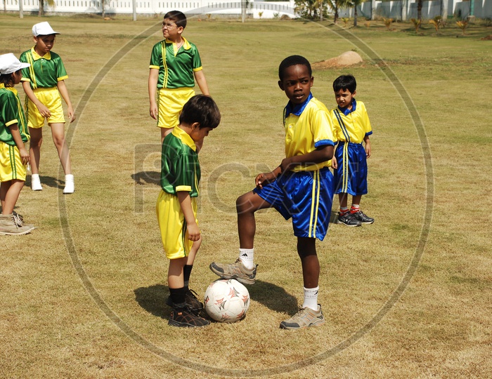 Children at the School Sport day - Playing Football