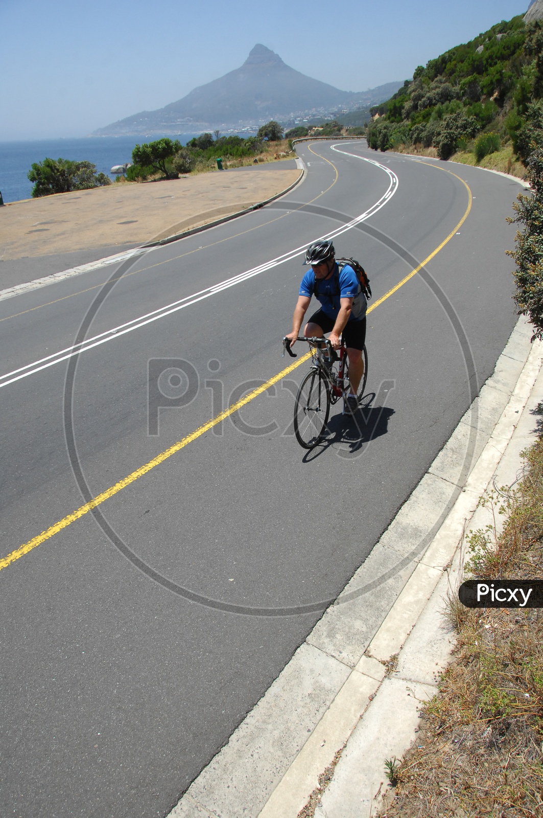 A Cyclist Cycling On a road