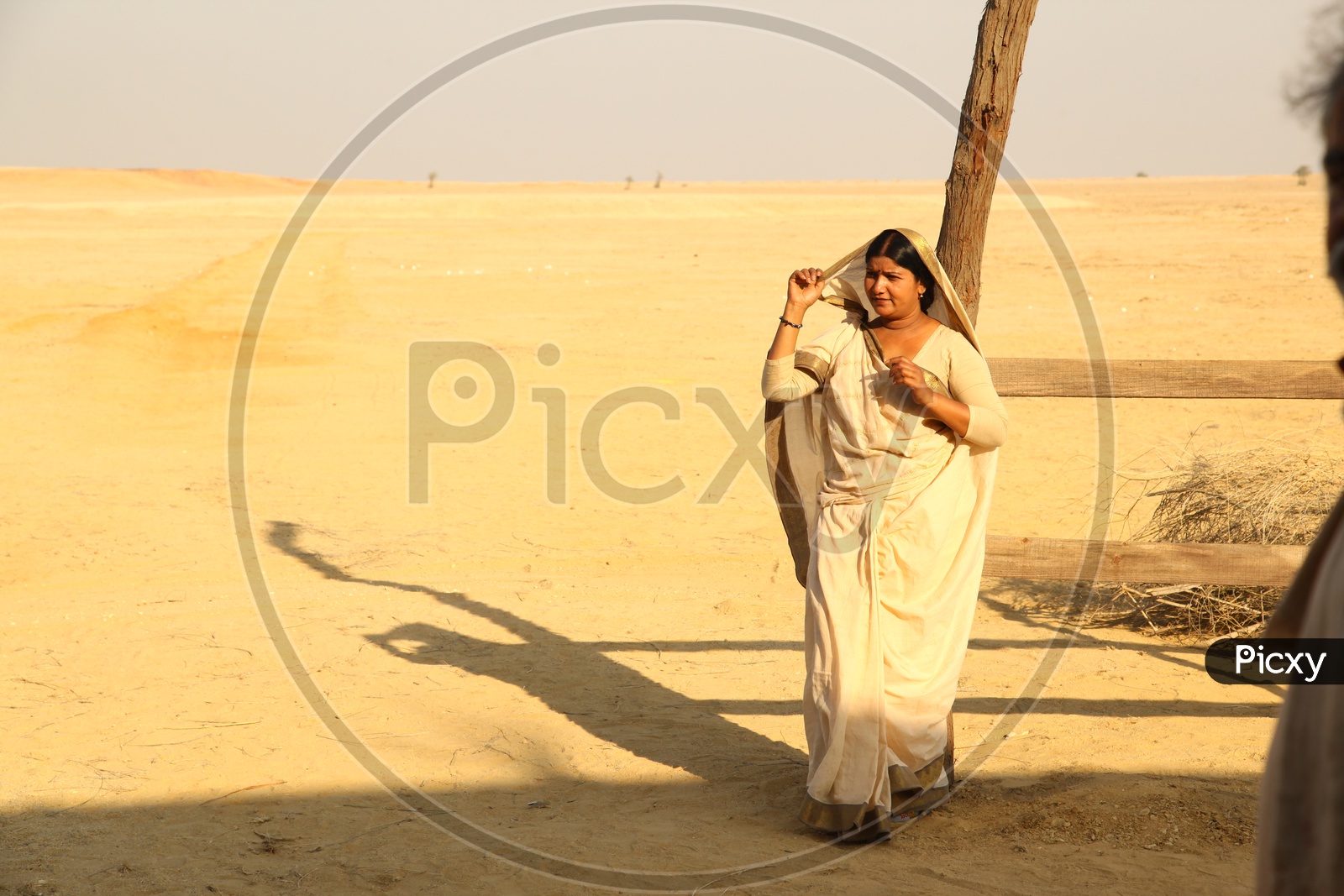 An indian rajasthani Woman Mother  in Desert Background