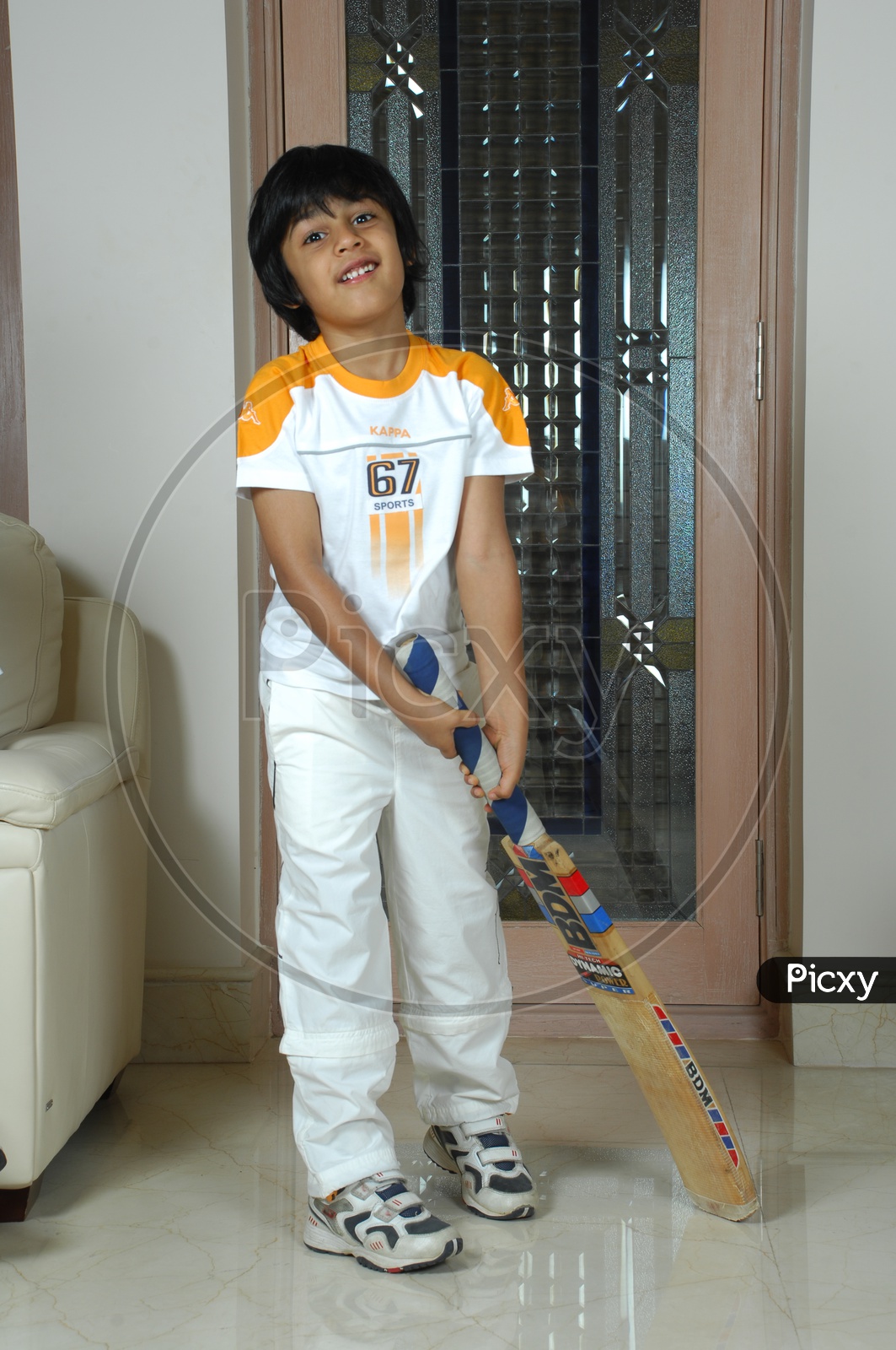 Indian Kid with cricket bat