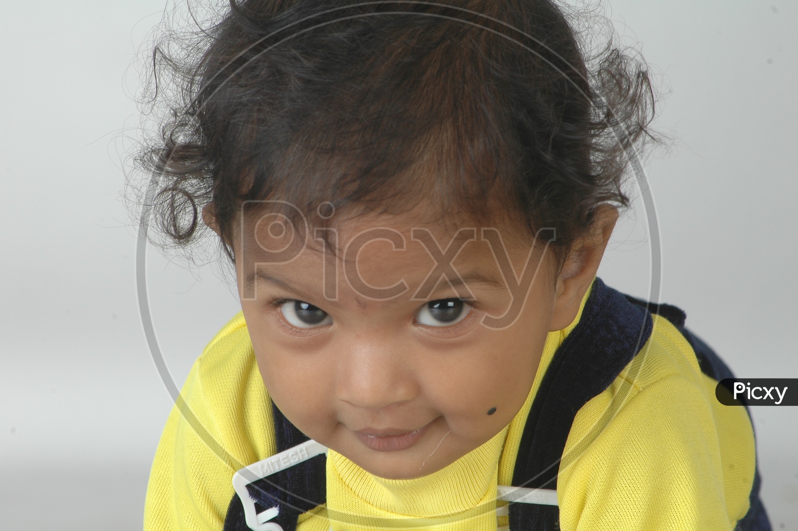 Indian Girl  Child Closeup Shot With Expressions over an Isolated White Background