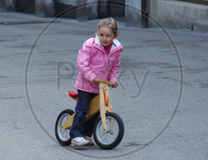 Girl Child Riding a Bicycle