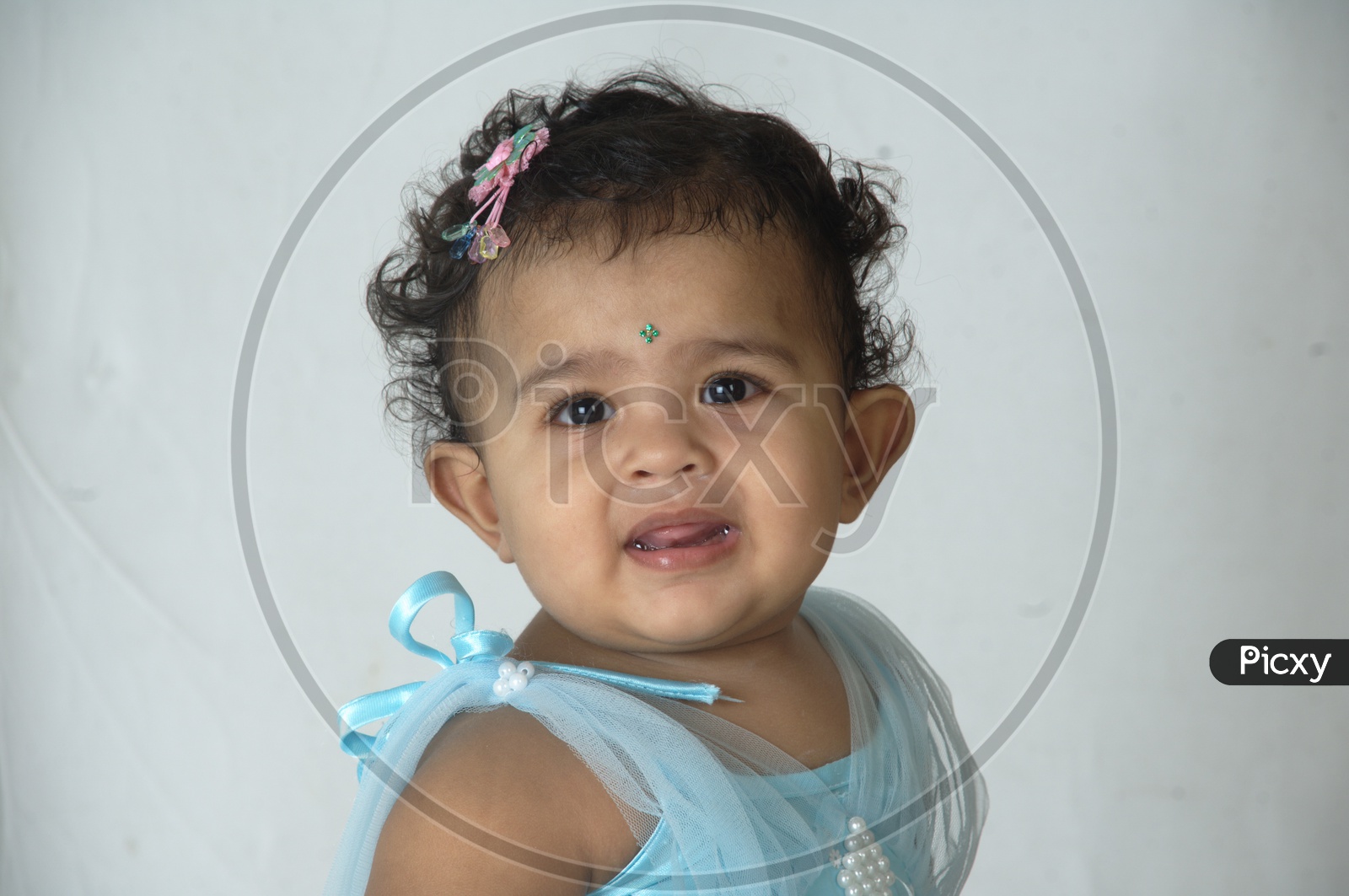 Indian Girl  Child Closeup Shot With Expressions over an Isolated White Background
