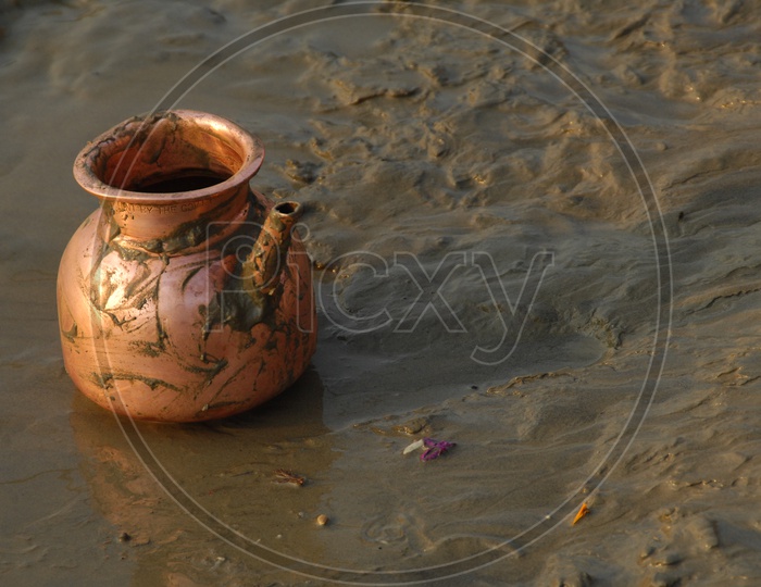 Brass Tea Vessel in Mud