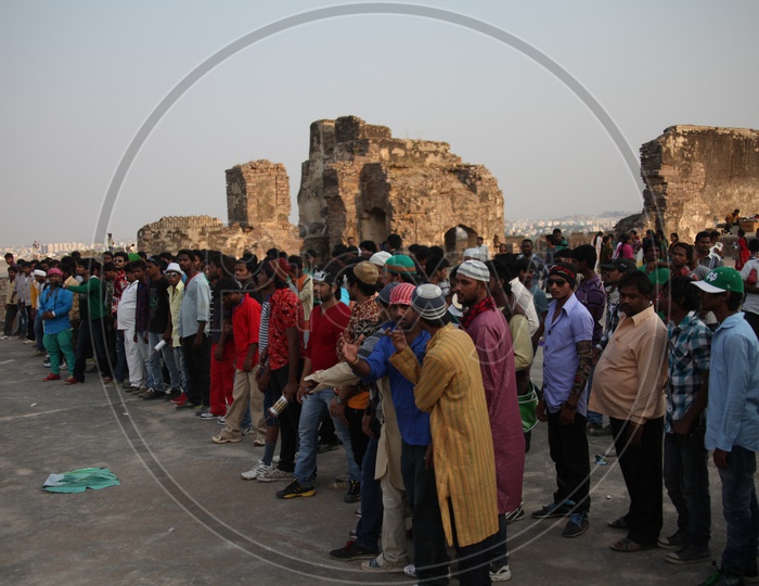People on the Roof top of Golconda fort with kites