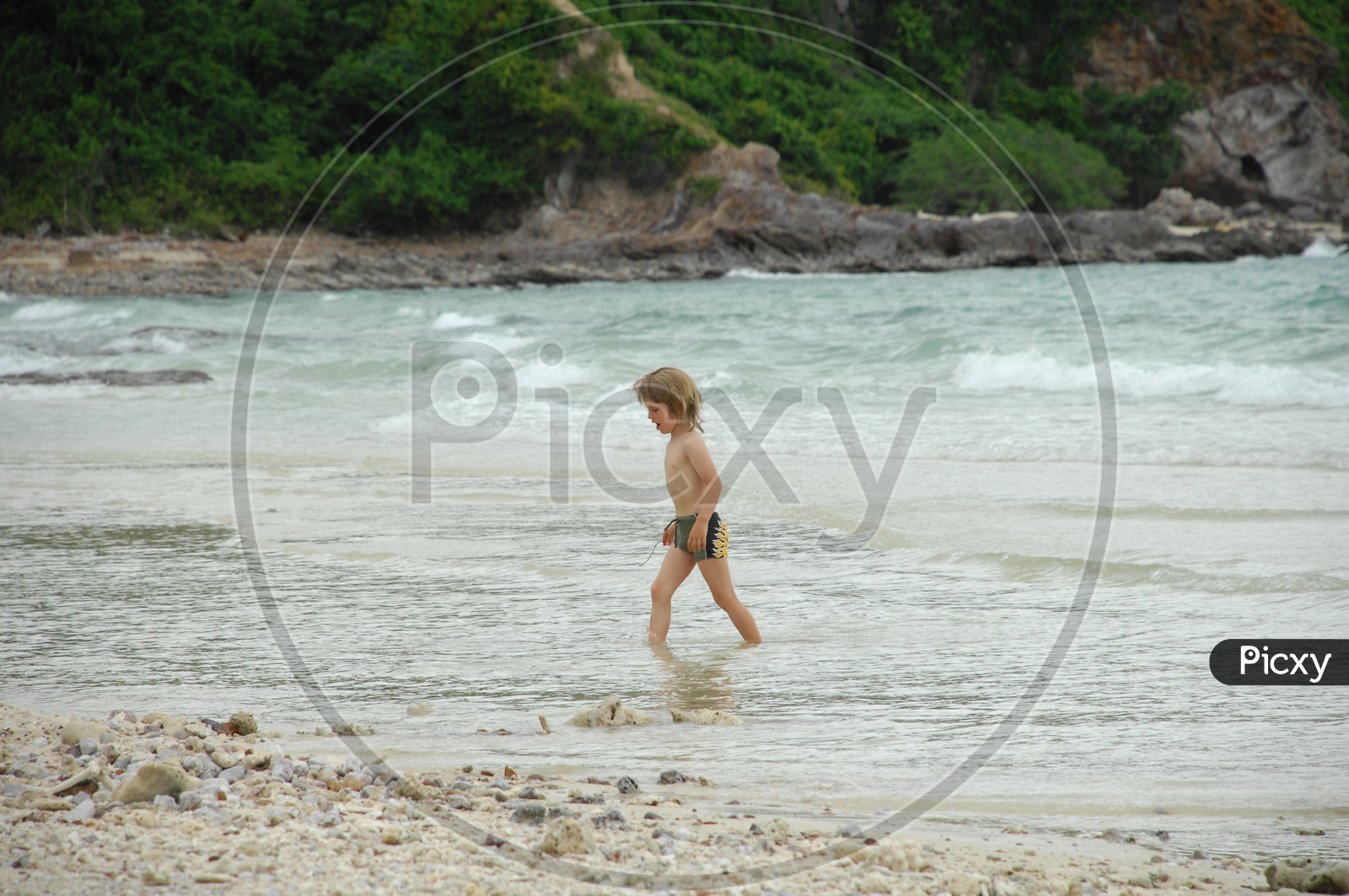 Girl kid in a beach