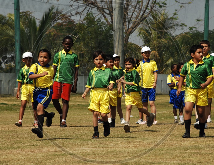 School Children Playing Football