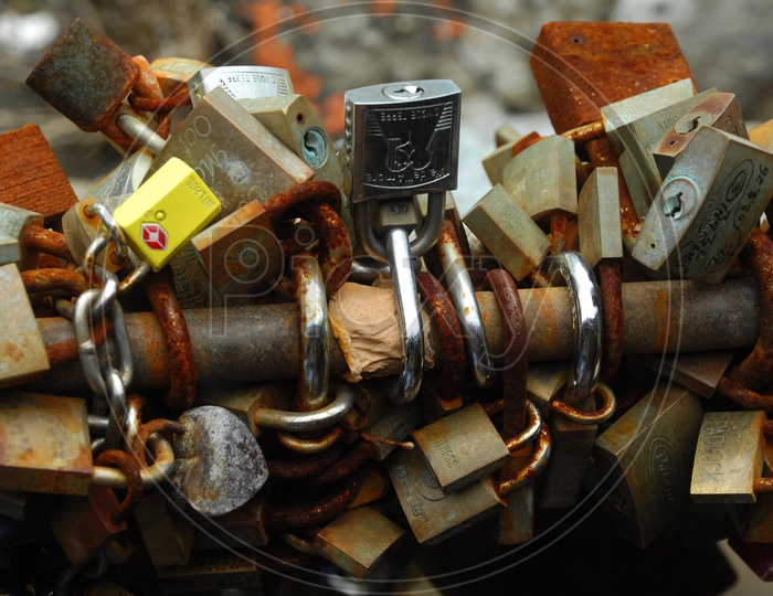 Locks Being Locked To a Iron Bar in Bulk