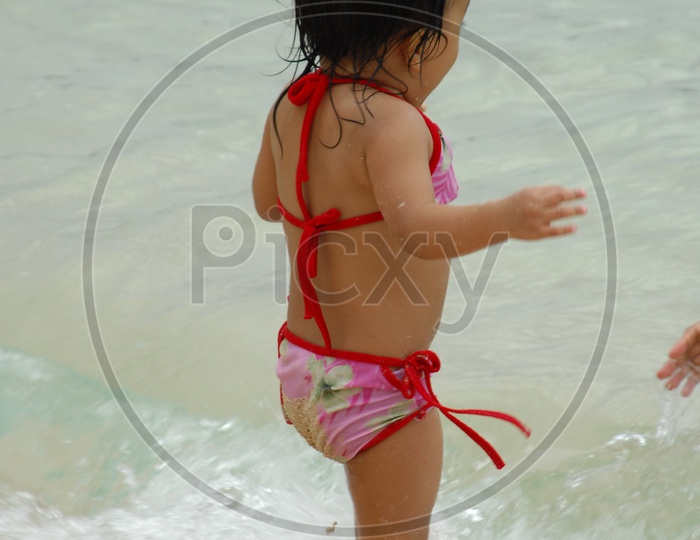 Girl kid in a beach