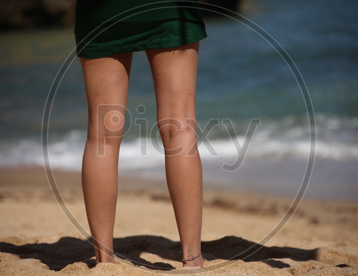 A Girl Legs Closeup Shot standing in  a Beach
