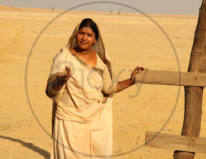 An indian rajasthani Woman Mother  in Desert Background