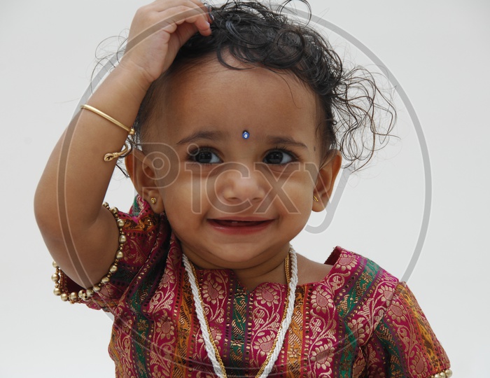 Adorable Indian Girl Child Closeup Shots With Cute expressions over an Isolated white Background