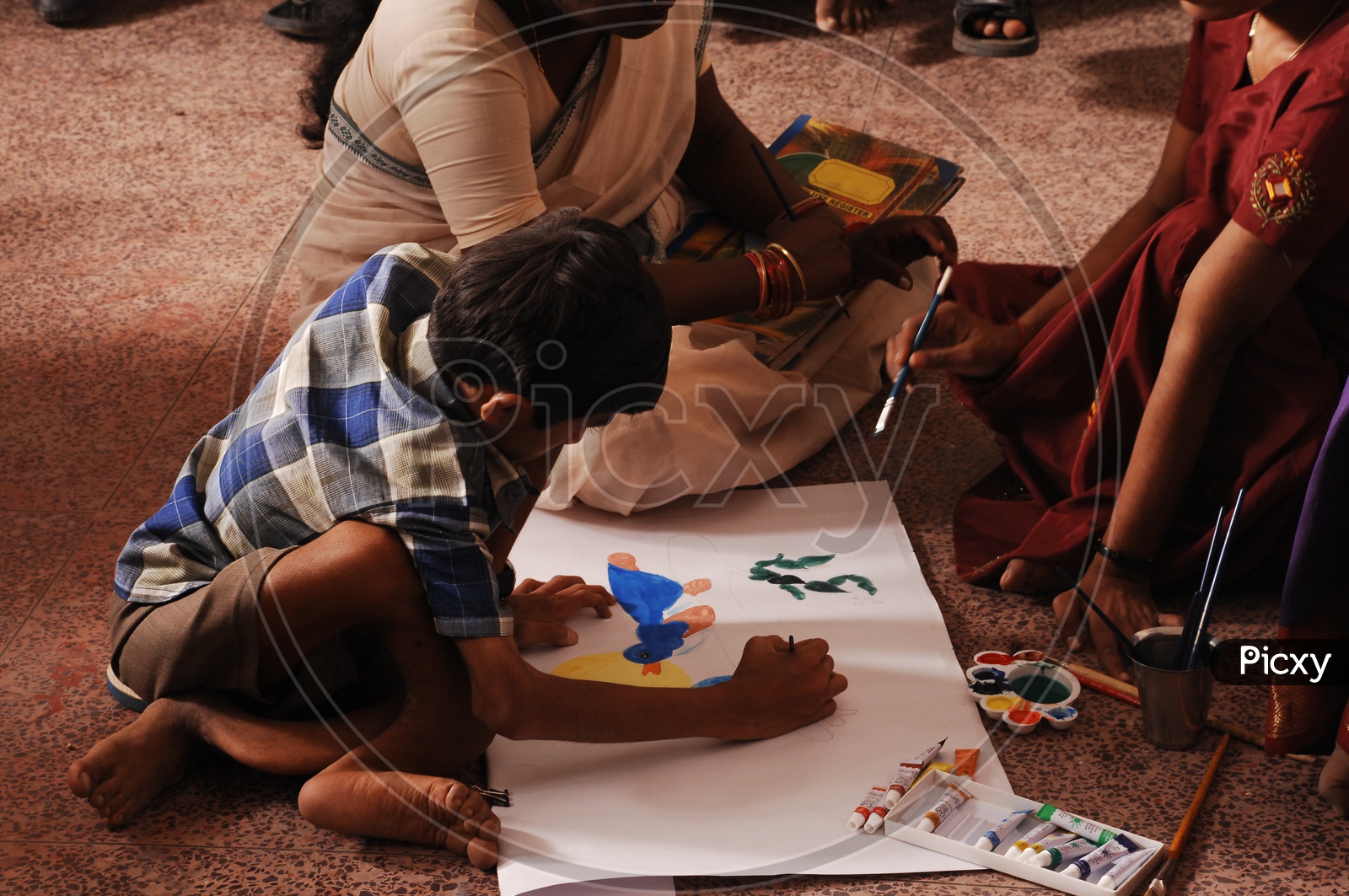 Children Doing Painting on a Painting book