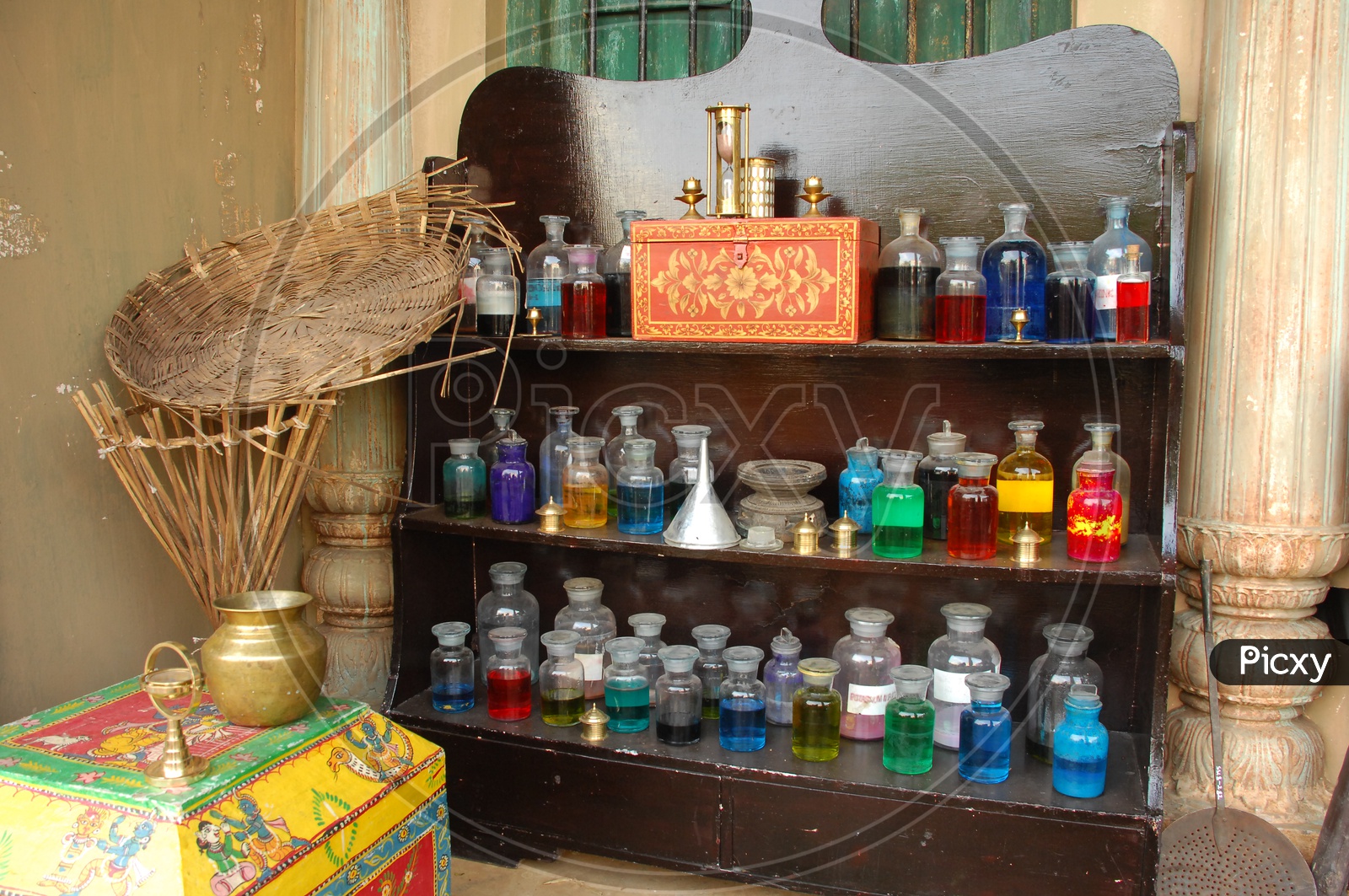 coloured Water Filled In Lad Glass Containers in Display