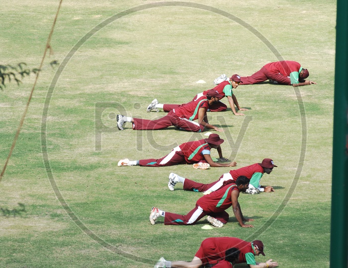 Cricketers in their Practice sessions working out in a ground