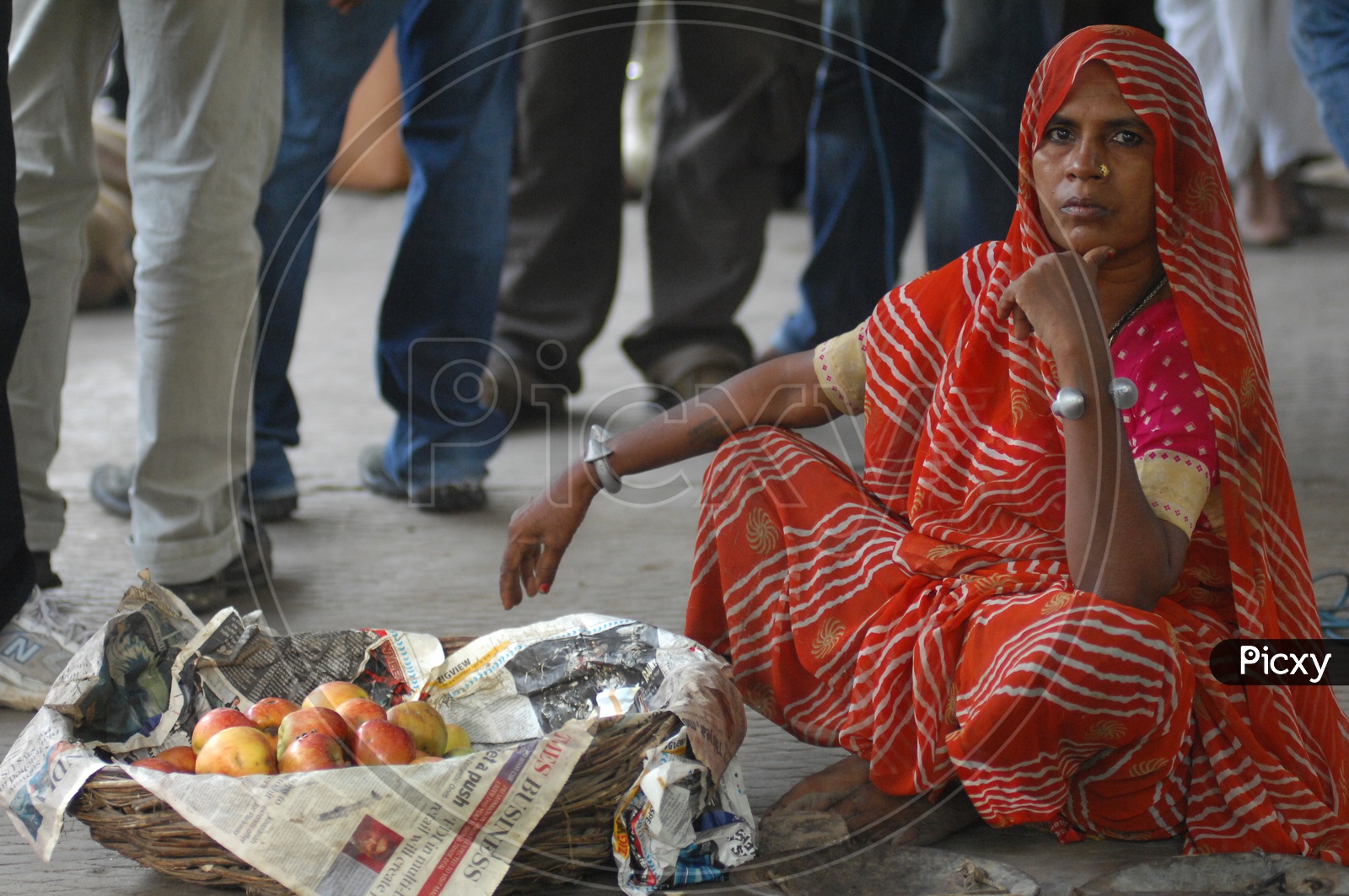Photograph of a women selling fruits / People Face