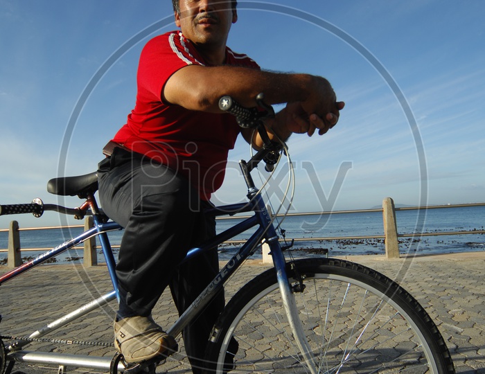 A man Cycling and posing