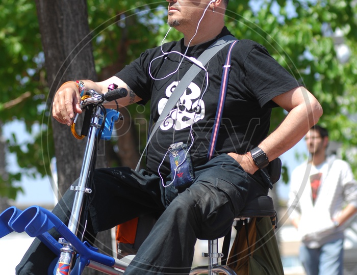 Physically Challenged man On a Cycle