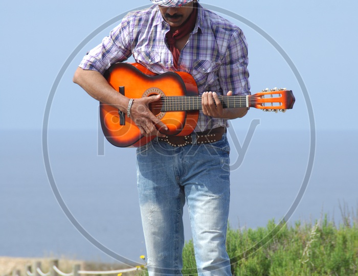 Actor Ravi Teja playing Guitar