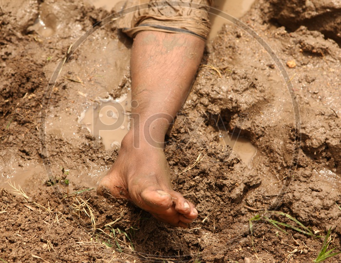Leg of a man in mud