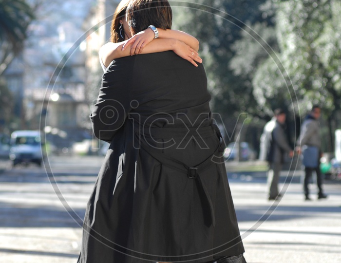 Young couple hugging on the road