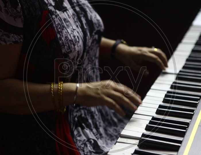 Woman Playing Grand Piano