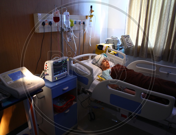 A Lady Patient in a Hospital Bed