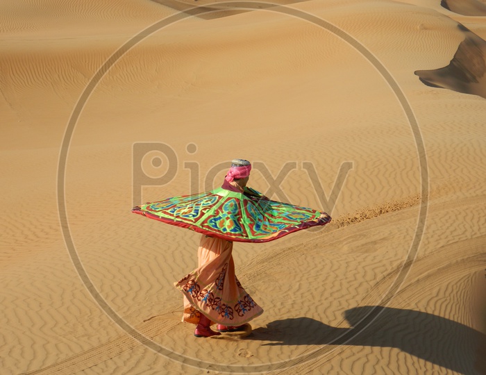 Man dancing in Dubai Desert