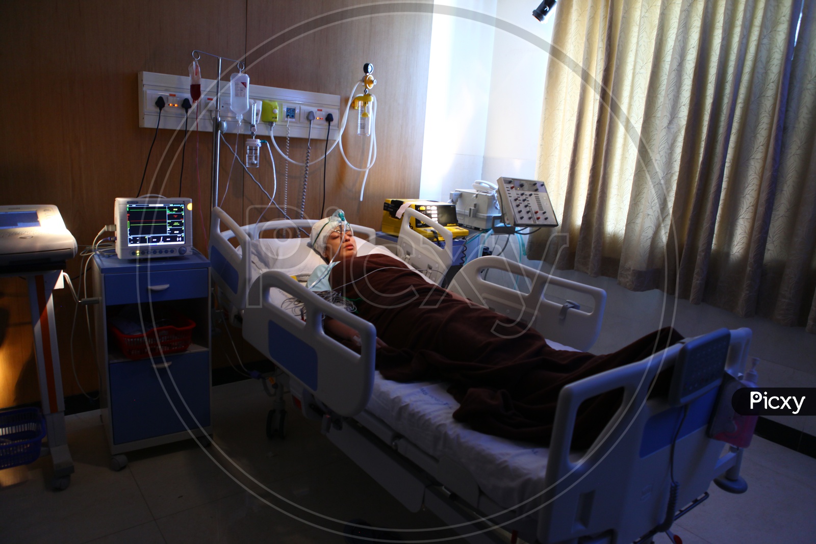 A Lady Patient in a Hospital Bed
