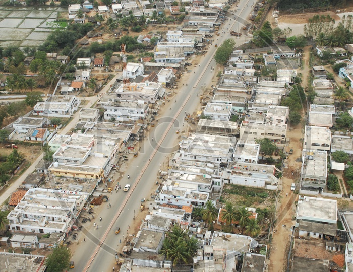 An Aerial View Of Industrial area in hyderabad  with Godown and houses  from Flight Window