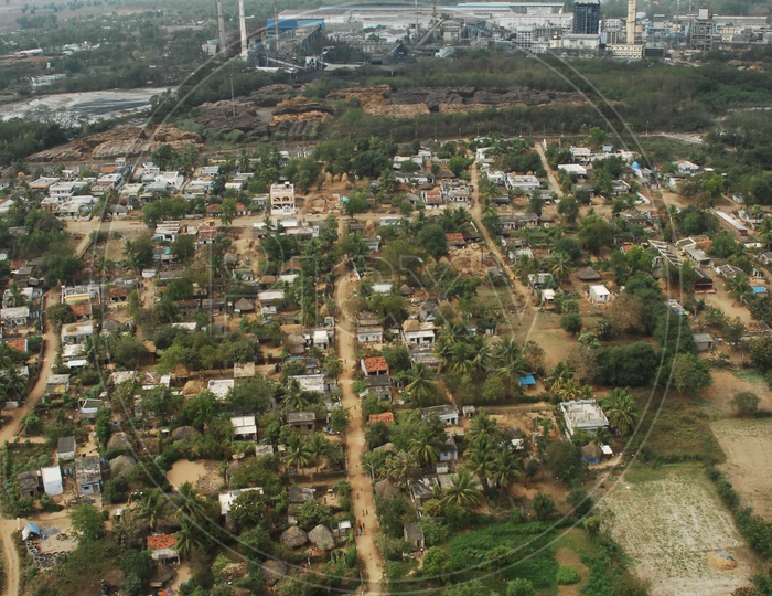Aerial View of an Industry / Factory With village in the foreground