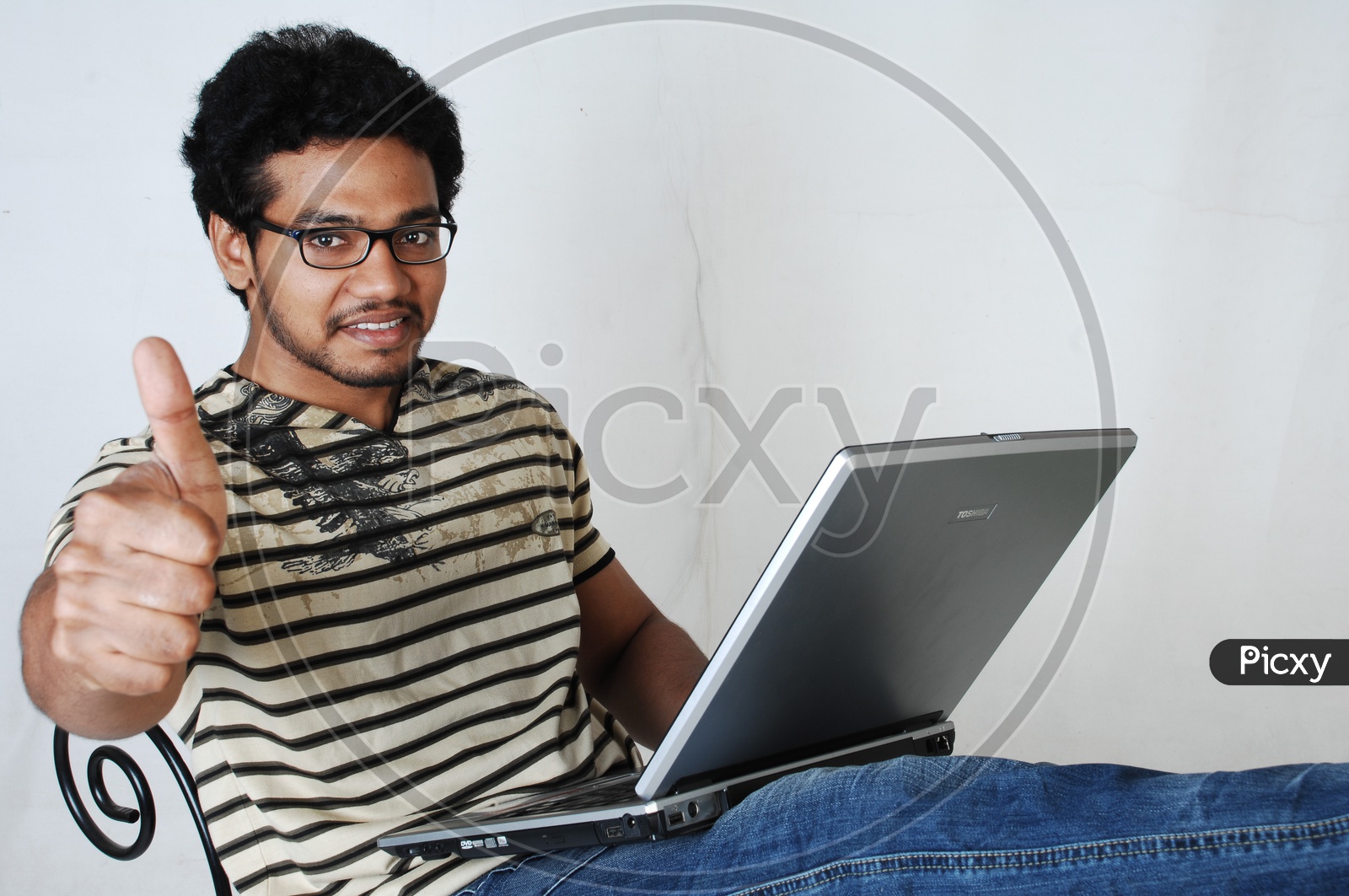 Young Indian Student With Laptop and Thumbsup Gesture  Smile Face