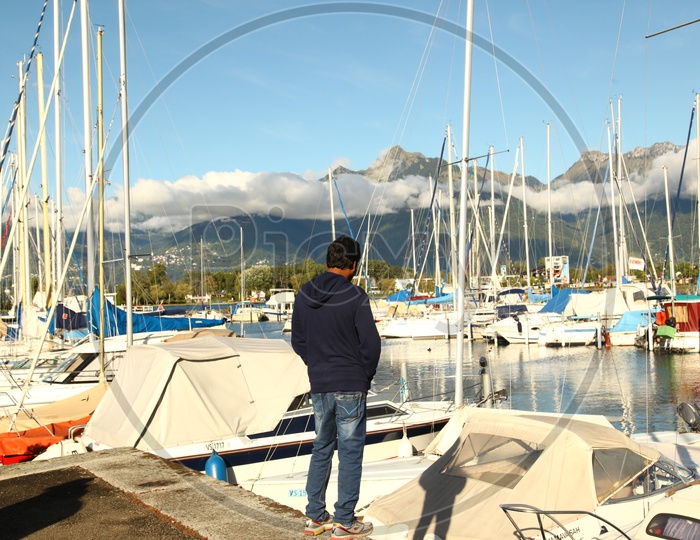 A man standing at the harbor
