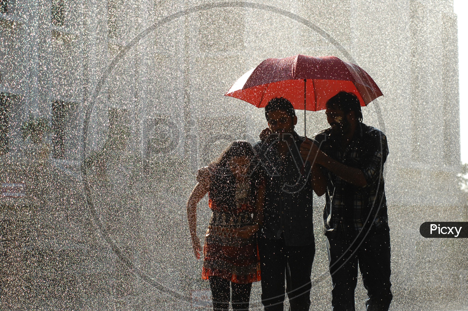 Three People Under One Umbrella