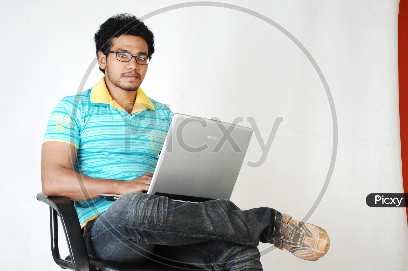 Young Indian Student with laptop