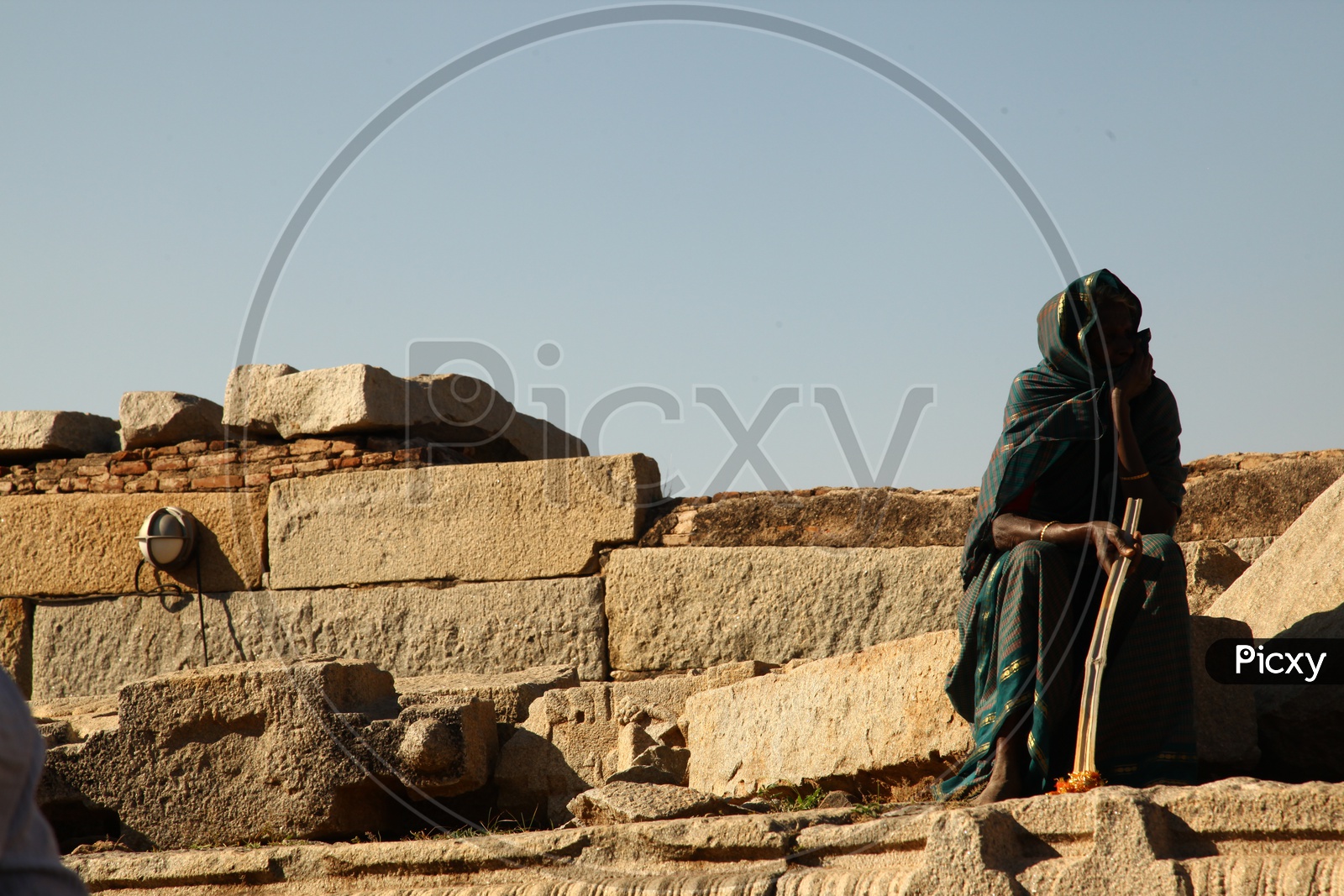 An old Indian woman at a temple