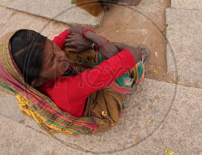 An old Indian woman sitting