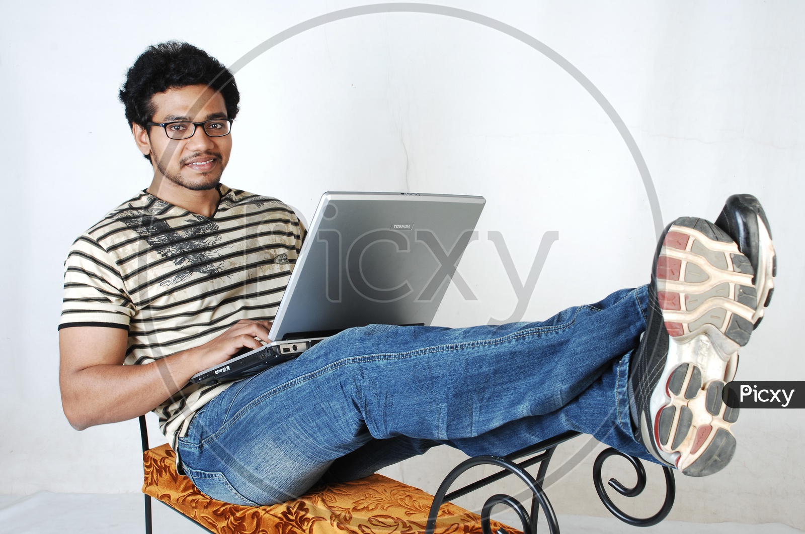Young IndianStudent With Laptop