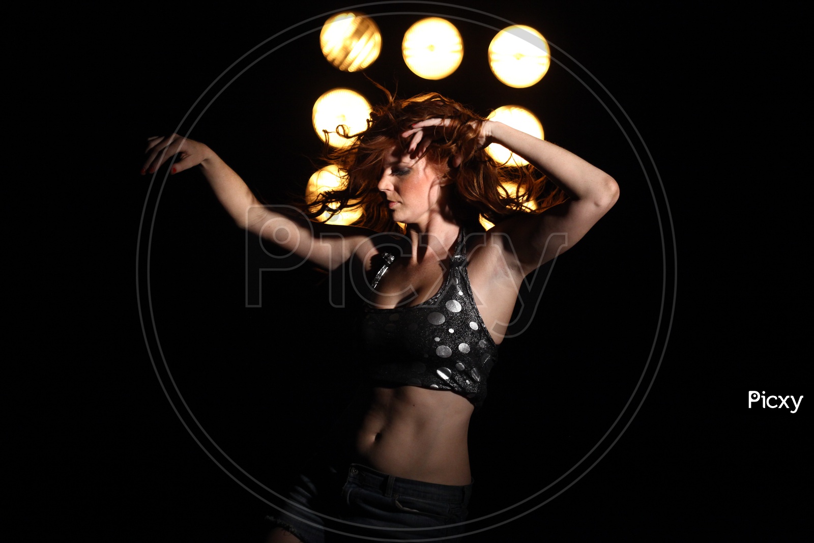 Woman Dancing with light on the background