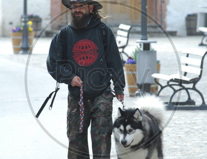 An English man walking with a Dog