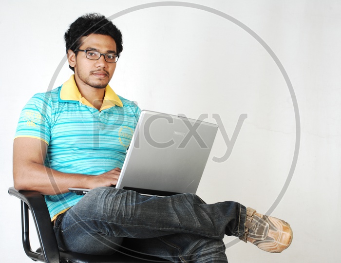 Young Indian Student with laptop