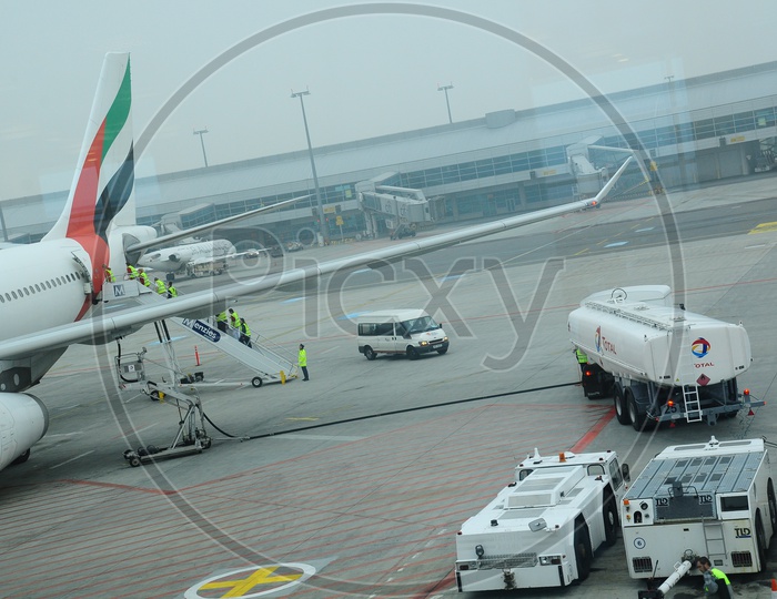 Ground crew  getting into the Emirates flight