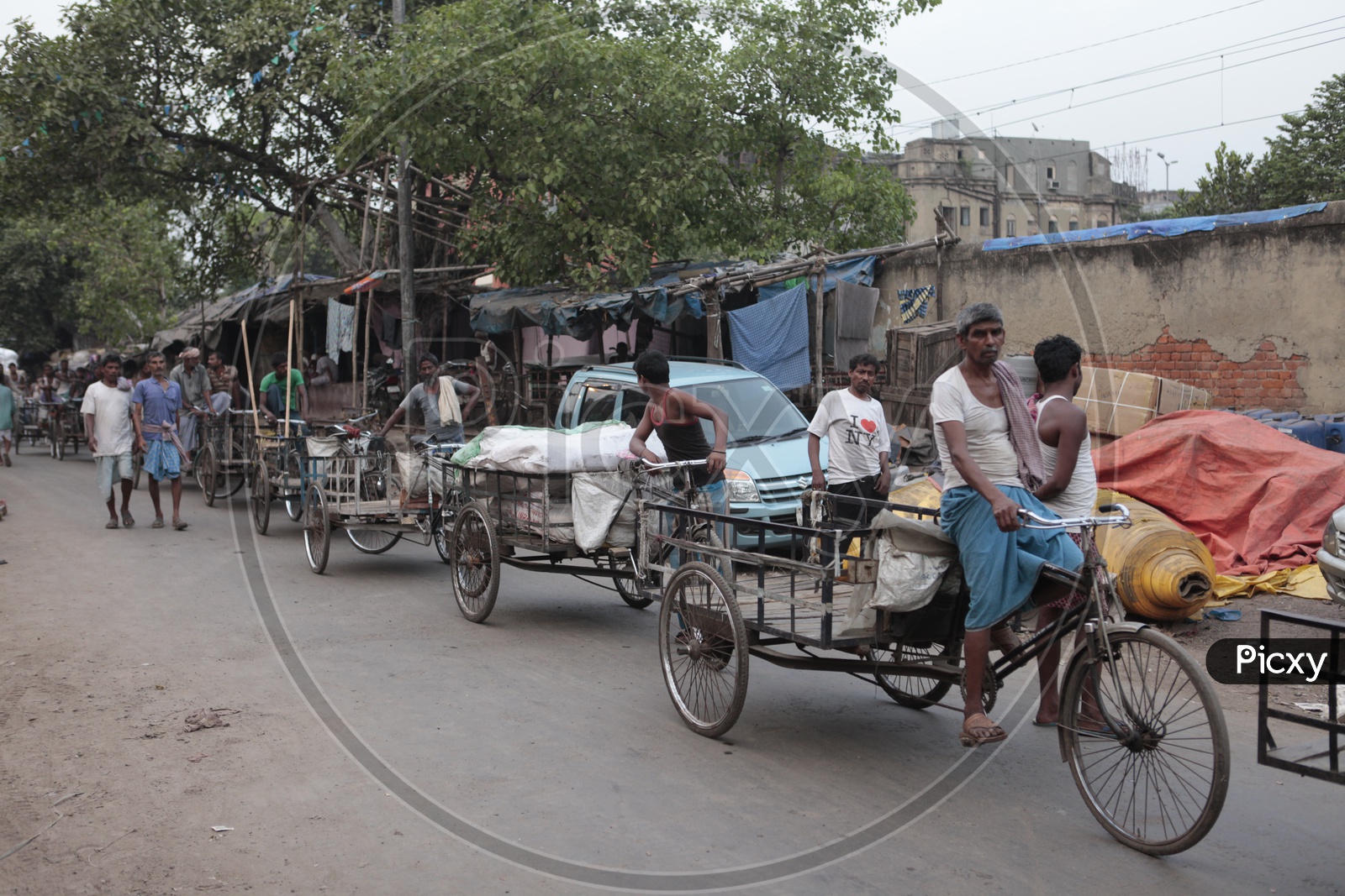 Men pedaling the rickshaw