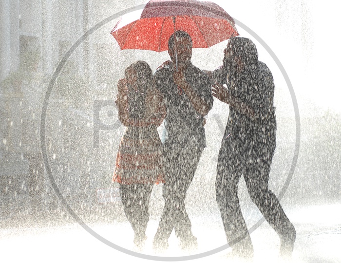 Three People Under One Umbrella